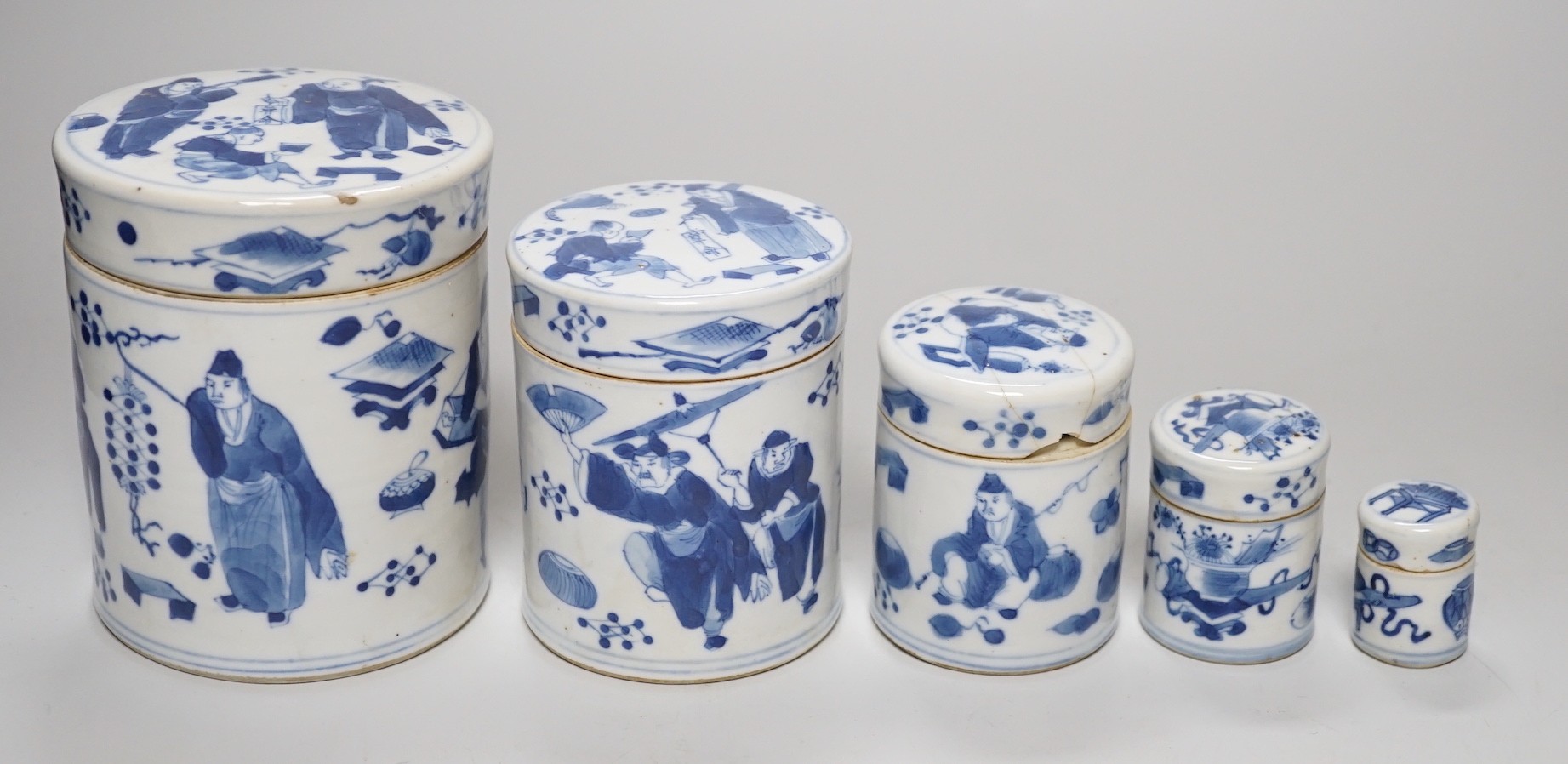 A set of four 19th century Chinese graduated blue and white jars and covers and a small jar with another design (5). Tallest 12cm